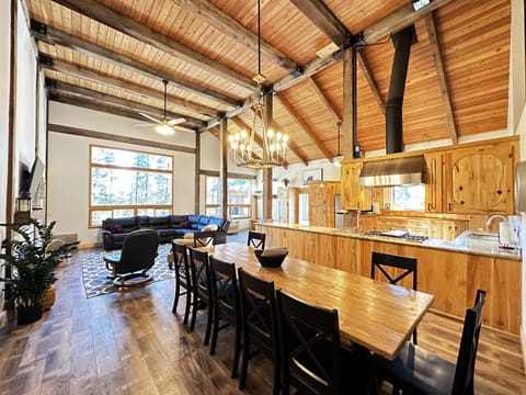 Beautiful dining room with a gorgeous custom made dining table, seats 12-15.