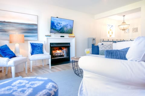 Living room with tv and gas fireplace