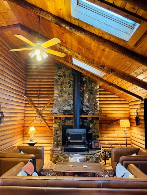 Living room, fireplace, skylights and  leather furniture
