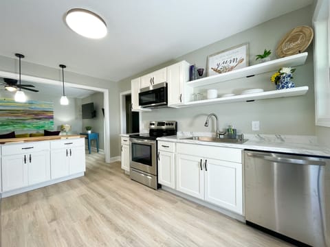You will enjoy cooking dinner in the fully stocked kitchen with new stainless steel appliances