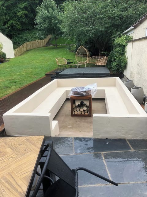 Sunken sitting area with log fire and just beyond you will need the hottub