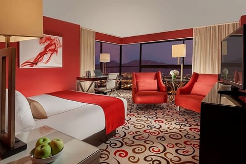 Soak in dazzling city views from this bold, luxe suite.