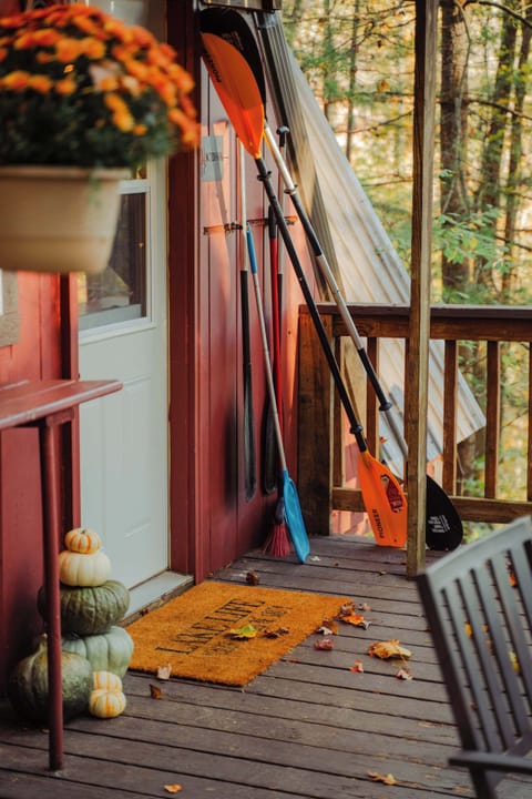 Welcoming Entrance: Step into adventure with colorful paddles and autumn charm at your door!