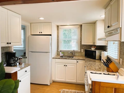 Kitchen with gas stove, microwave, toaster, and everything you need!