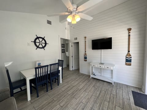 Living room with dinning table and queen sofa-bed