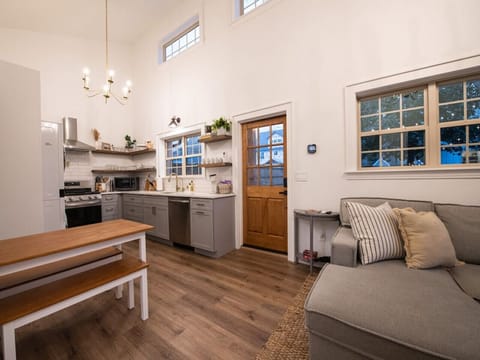 Dining table seats 5 if you are willing to get close. After all, it is the Cozy Cottage!