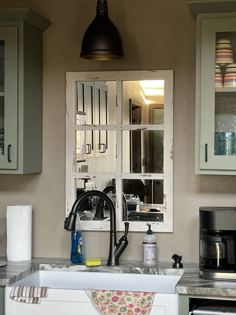 Over the sink --- mirror that looks like a window 