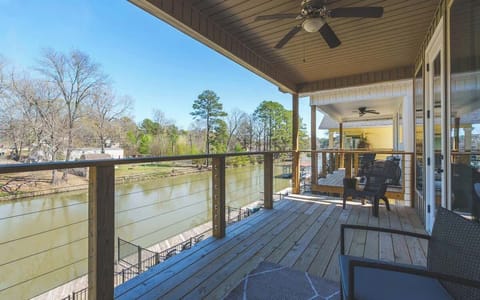 Relax on the covered balcony with peaceful water views and plenty of space to unwind.