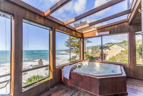 watch the sunset from this indoor hot tub