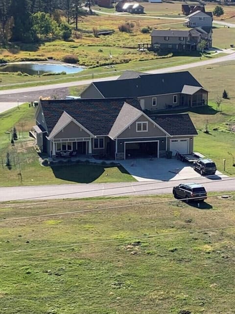 aerial view of house from the mountain directly out the front door.