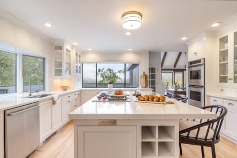 Spacious kitchen with a gas range.