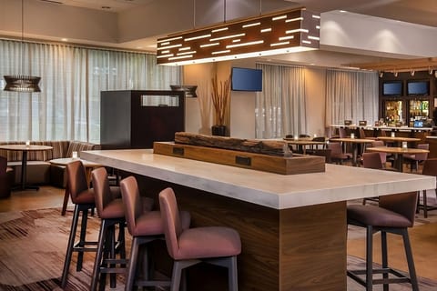 Sip and snack at the chic communal table and bar