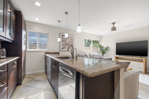 Gourmet Kitchen: Cook up memories in this spacious kitchen with modern appliances and island seating!