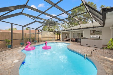 Poolside Retreat: Dive into relaxation with a sparkling pool and vibrant flamingo floats!