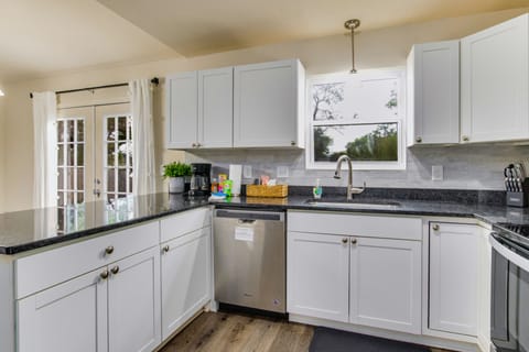 The kitchen boasts ample counter space, perfect for meal prep and cooking.