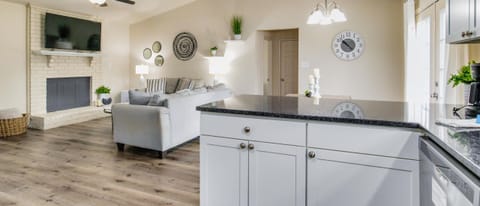 The kitchen's open concept allows for easy conversation and connection while cooking.