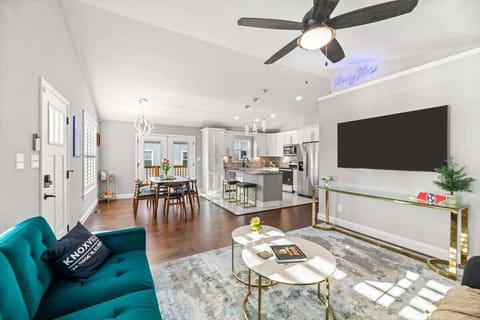 Welcome to the heart of the Harvey House, an inviting living room with a big Smart TV and plenty of space to relax.