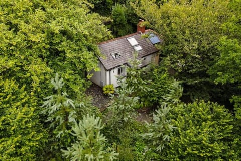 Hidden on a wooded hillside.