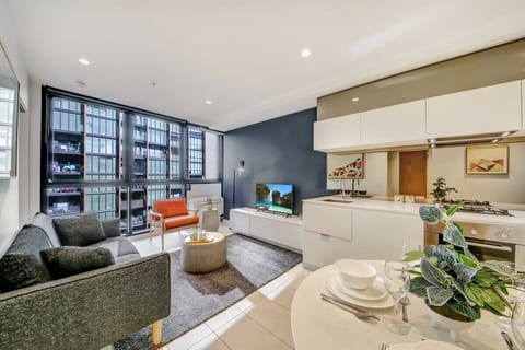 A bright & cozy living area with a 2-seater couch.