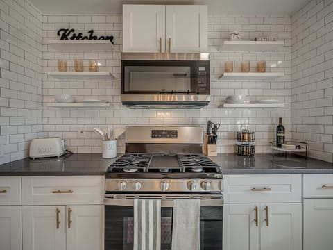 Fully-equipped kitchen. Sophisticated, yet functional, access to everything you need to cook as easily as if you were home. Updated stainless steel appliances, including a large fridge/freezer, and a 4-burner gas stove.