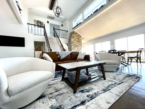 main living room & dining room/ stairs lead to master suite