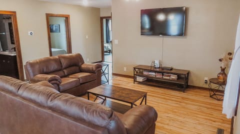 Relax in the living room area while streaming a movie on the 55" TV.