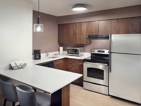 Cook easy meals in a modern kitchen with full appliances.