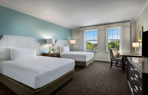 Wake up to sunshine and serene views from plush beds.
