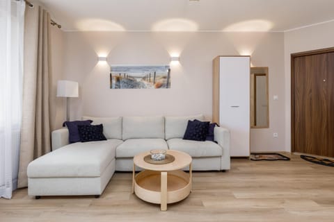 Living room with a comfortable sofa and TV. 