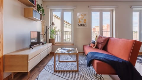 Living area with a sofa and TV for laidback moments #relax #airbnb