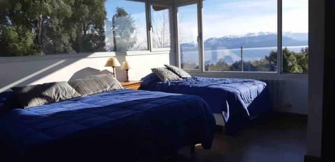 Main room in first floor with queen bed and single bed and stunning views