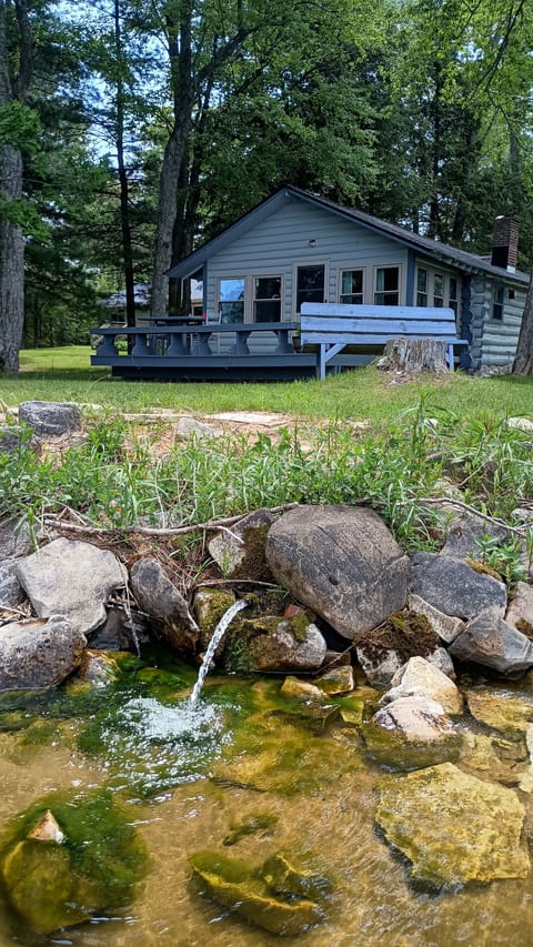 Artesian well in front of the cabin emptying into Indian Lake. Have a drink!