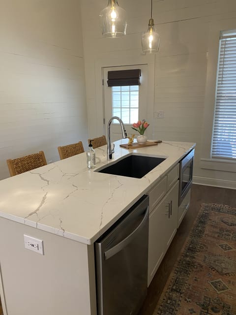Kitchen with view of back door entrance.
