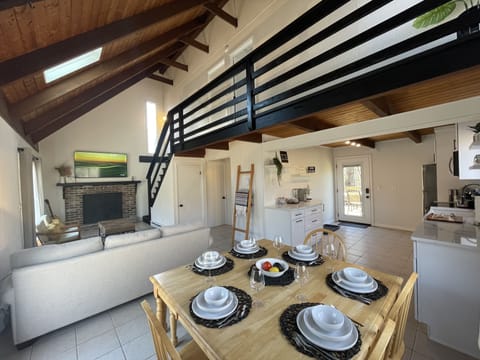 Open floor plan of living room, dining area and kitchen.