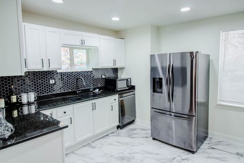 Fully equipped kitchen with modern appliances and all the essentials for cooking.