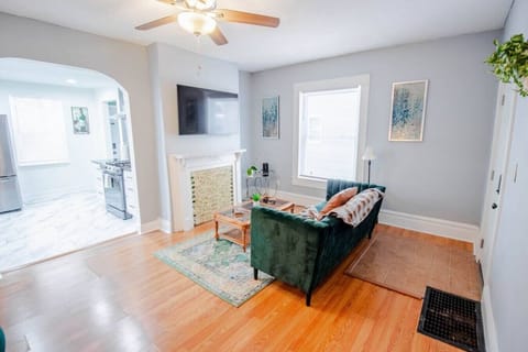 Spacious and bright living room featuring comfortable seating and modern decor.