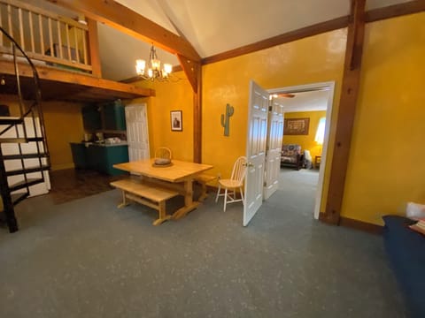 The open concept dining area and kitchen  and a peek at the separate living area