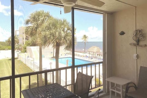Enjoy beach and pool views from the comfort of the screened patio.