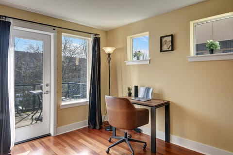 Main level desk and leather office chair make working from home a breeze!