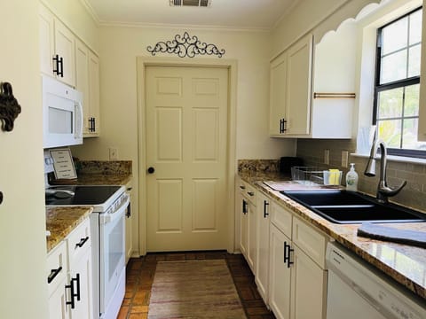Galley-style kitchen with ample counter space for meal (or snack) prep