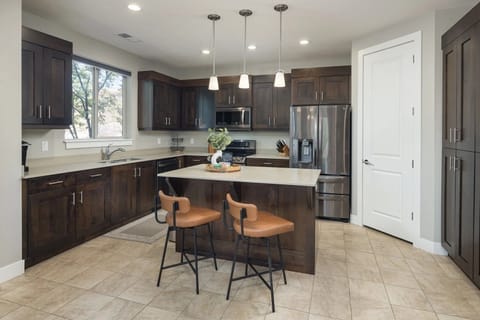 Kitchen Area with Appliances & Island in the middle