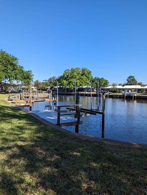 Private dock with boat lift and extended ladder for easy kayak loading