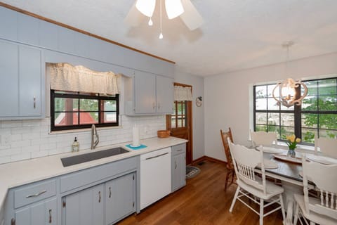 View from kitchen looking towards dining table for 6 and the back door leading to the screened-in porch