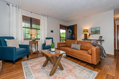 View of the cozy living room looking towards the front entry