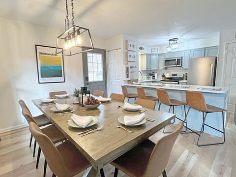 Open concept kitchen and dining area.  Keep the cook company while they're doing the hard work! 
