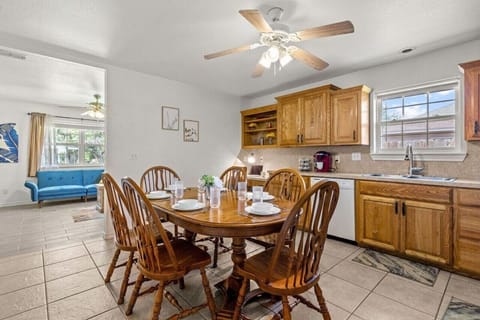 Oak dining table with a standard seating for six, but there are two extra chairs available to easily fit in around our oval table.