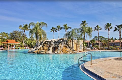 Cool off in this crystal-clear pool, surrounded by tall palm trees.