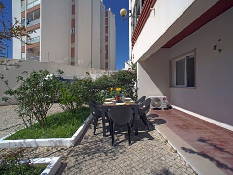 Plant, Table, Property, Furniture, Window, Chair, Building, Outdoor Table, Shade, Flower