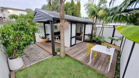 Fully fenced Studio unit with decks & tropical gardens. French doors open out. 