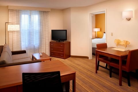Settle in with a cozy sofa and easy in-room dining.